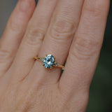 2.01ct Oval Precision Cut Denim Blue Untreated Montana Sapphire and Princess Cut Diamond Rapids Low Profile Ring in 18k Yellow Gold