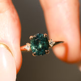 1.98ct Oval Precision Cut Teal Montana Sapphire and Princess Cut Diamond Rapids Low Profile Ring in 14k Yellow Gold