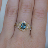 1.22ct Madagascar Geo Oval Sapphire and Diamond Floral Halo in 18k Yellow Gold