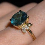 4.20ct Oval Blue Madagascar Sapphire in Wandering Vine Low Profile 4 Prong Setting with Diamonds in 18k Yellow Gold