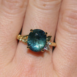 4.20ct Oval Blue Madagascar Sapphire in Wandering Vine Low Profile 4 Prong Setting with Diamonds in 18k Yellow Gold
