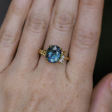4.20ct Oval Blue Madagascar Sapphire in Wandering Vine Low Profile 4 Prong Setting with Diamonds in 18k Yellow Gold