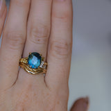 4.20ct Oval Blue Madagascar Sapphire in Wandering Vine Low Profile 4 Prong Setting with Diamonds in 18k Yellow Gold