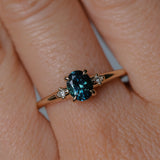 0.85ct Oval Deep Teal Montana Sapphire and Princess Cut Diamond Rapids Low Profile Ring in 14k Yellow Gold