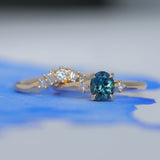 0.85ct Oval Deep Teal Montana Sapphire and Princess Cut Diamond Rapids Low Profile Ring in 14k Yellow Gold