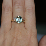 3.07ct Untreated Oval Madagascar Sapphire in Wandering Vine Low Profile 4 Prong Setting with Diamonds in 14k Yellow Gold