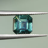 2.16CT MADAGASCAR EMERALD CUT SAPPHIRE, DEEP GREEN WITH SOME YELLOW AND TEAL, 6.9X6.8X4.6MM