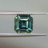 2.16CT MADAGASCAR EMERALD CUT SAPPHIRE, DEEP GREEN WITH SOME YELLOW AND TEAL, 6.9X6.8X4.6MM