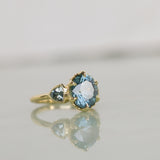 3.93ct Untreated Oval Teal Montana Sapphire and Trillion Australian Sapphire Three Stone Scallop Cup Antique Style with Milgrain Low Profile Ring in 18k Yellow Gold