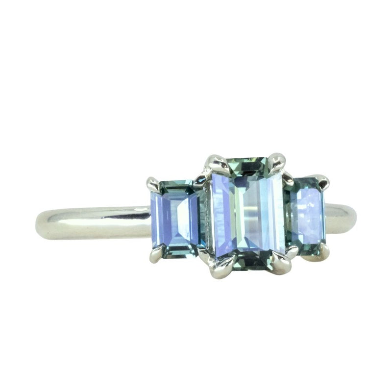 0.95ct Madagascar Emerald Cut and 0.67ctw Montana Sapphire Three Stone Low Profile Ring in 14k Green Gold