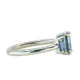 0.95ct Madagascar Emerald Cut and 0.67ctw Montana Sapphire Three Stone Low Profile Ring in 14k Green Gold