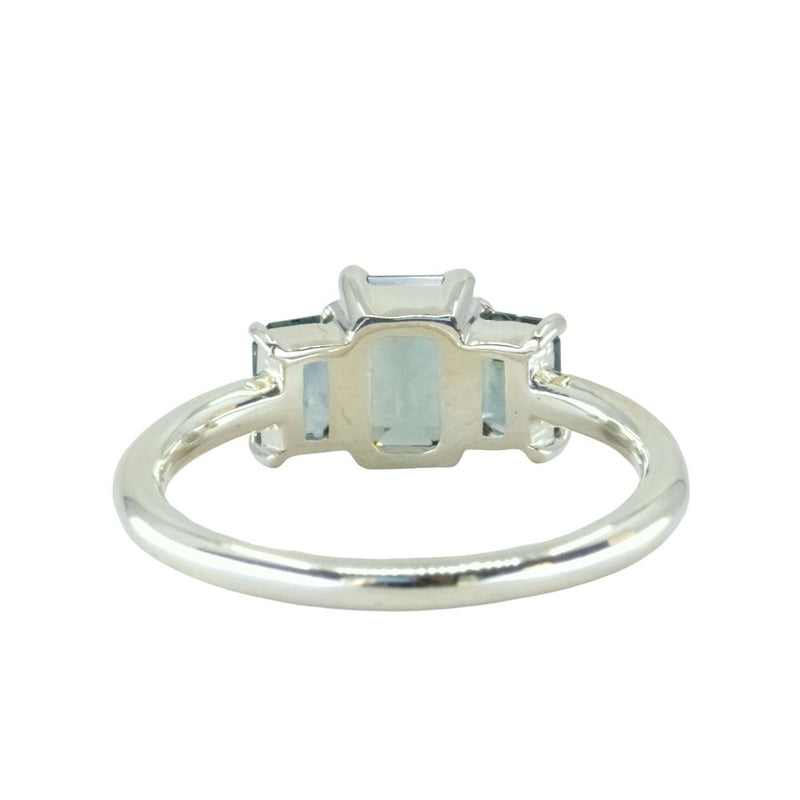 0.95ct Madagascar Emerald Cut and 0.67ctw Montana Sapphire Three Stone Low Profile Ring in 14k Green Gold