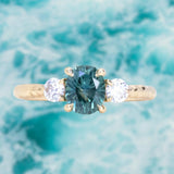 1.36ct Oval Montana Sapphire and Lab Diamond Three Stone Ring in 14K Yellow Gold with Evergreen Texture
