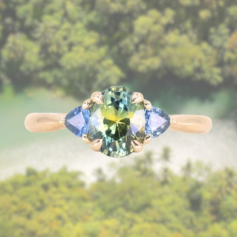 1.68ct Oval Untreated Madagascar Parti Sapphire and Trillion Sapphire Three Stone Low Profile Ring in 14k Yellow Gold