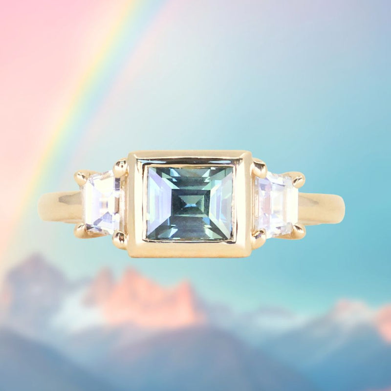 1.06ct Unheated Step Cut Teal Bezel Set Sapphire and White Cadillac Prong Set Sapphire Low Profile Three Stone Ring in 14k Yellow Gold