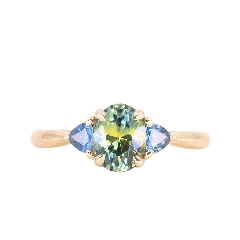 1.68ct Oval Untreated Madagascar Parti Sapphire and Trillion Sapphire Three Stone Low Profile Ring in 14k Yellow Gold