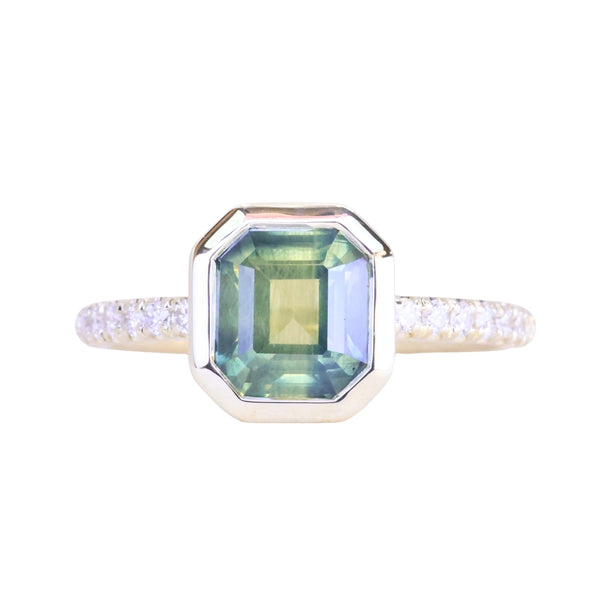 2.18ct Emerald Cut Parti Madagascar Sapphire Low Profile Bezel Solitaire Ring with Pavé Set Diamonds in 14k Green Gold