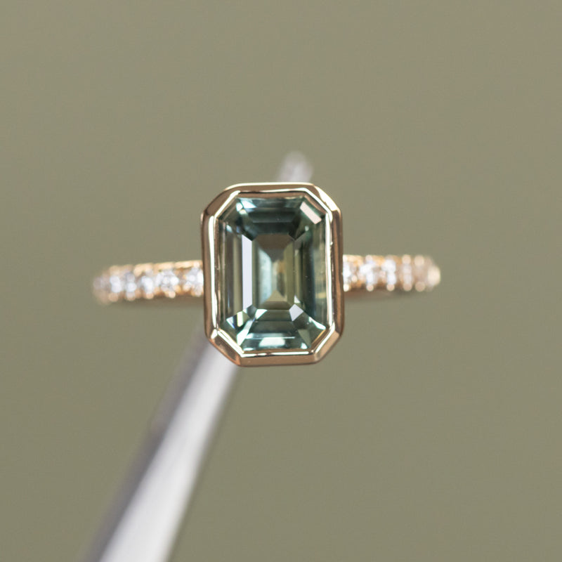 3.02ct Emerald Cut Madagascar Minty Sapphire Low Profile Bezel Solitaire Ring with French Set Diamonds in 14k Yellow Gold