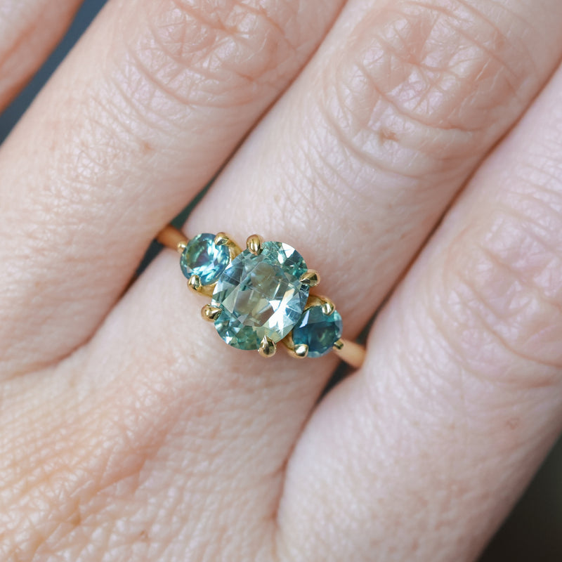 1.74ct Unheated Oval Montana Sapphire and Madagascar Sapphire Low Profile Three Stone Ring in 18k Yellow Gold