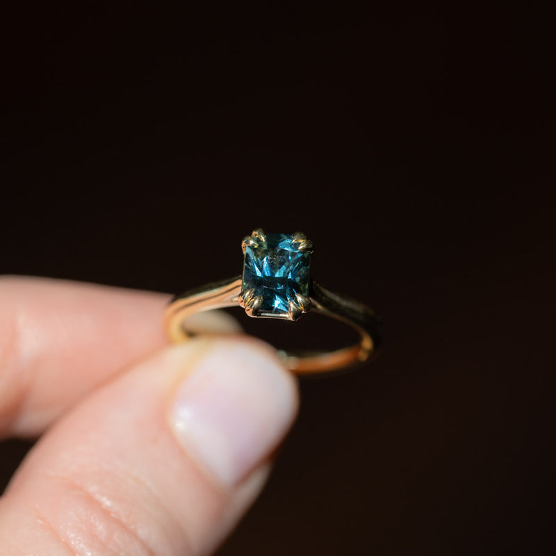 1.68ct Radiant Cut Teal Sapphire Cathedral Double Prong Solitaire in 18k Yellow Gold