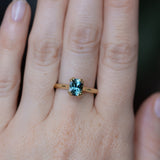 1.68ct Radiant Cut Teal Sapphire Cathedral Double Prong Solitaire in 18k Yellow Gold