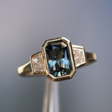 2.02ct Untreated Radiant Cut Color Shifting Sapphire and White Diamond Three Stone Bezel Set Ring in 14k Yellow Gold