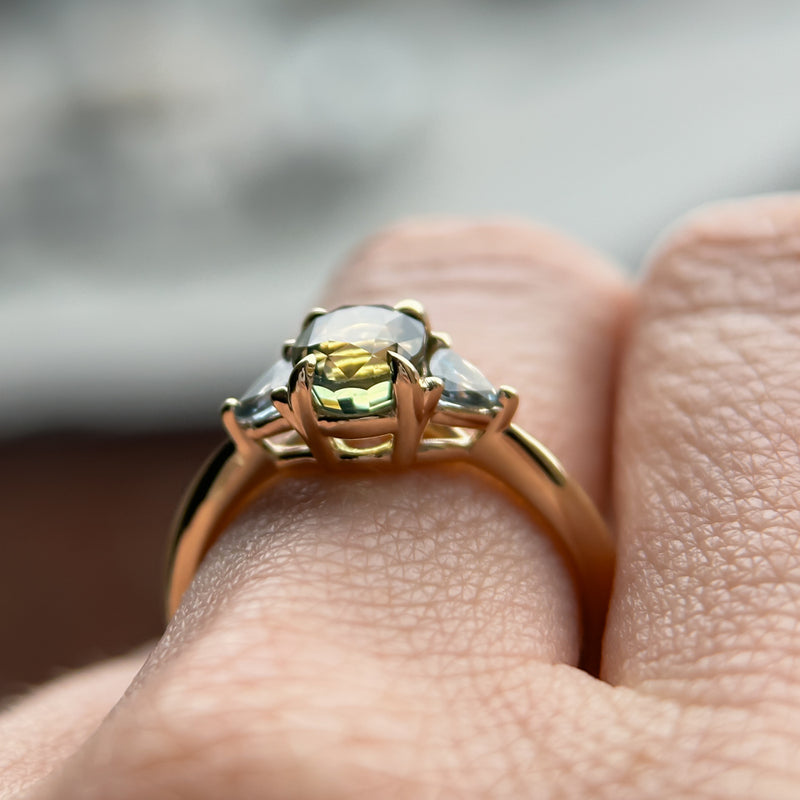 1.61ct Oval Madagascar Parti Sapphire and Trillion Sapphire Three Stone Low Profile Ring in 14k Yellow Gold