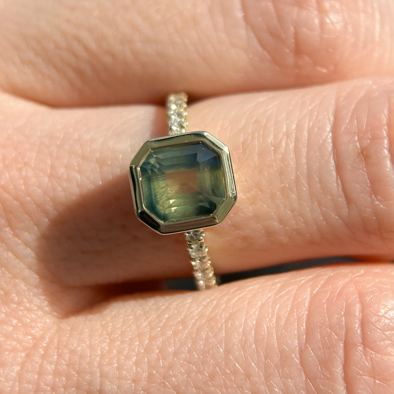 2.18ct Emerald Cut Parti Madagascar Sapphire Low Profile Bezel Solitaire Ring with Pavé Set Diamonds in 14k Green Gold