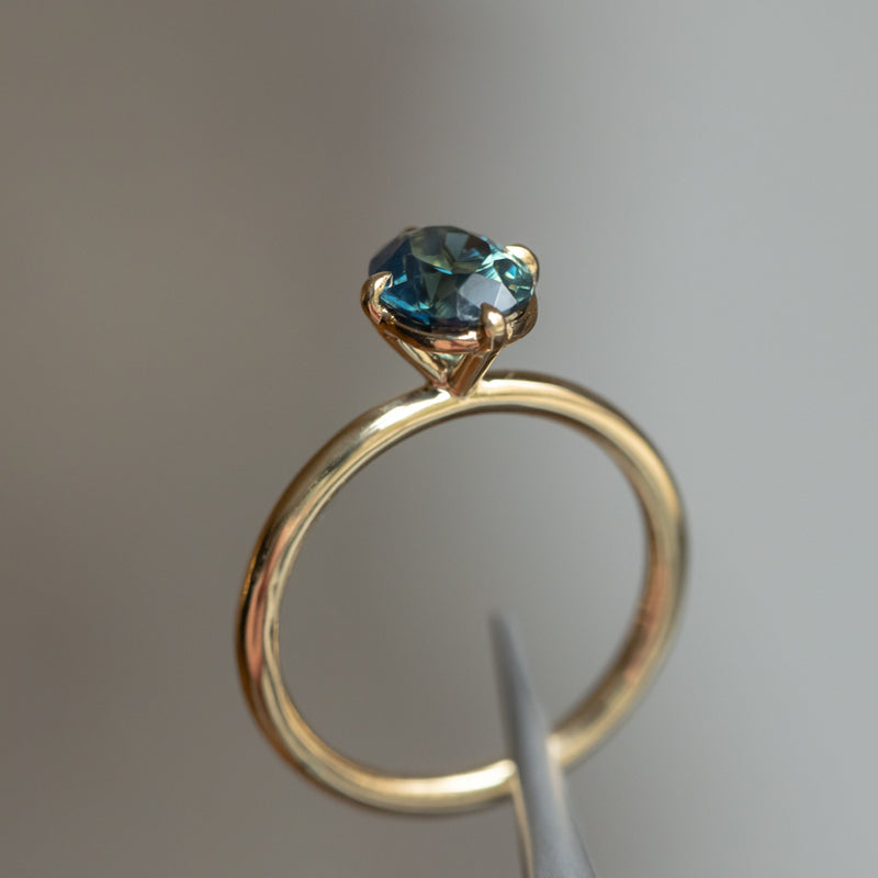 1.65ct Untreated Deep Teal Nigerian Oval Sapphire Four Prong Compass Set Solitaire in 18k Yellow Gold