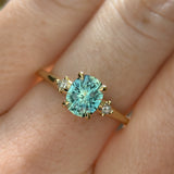 1.20ct Oval Brilliant Teal Montana Sapphire and Princess Cut Diamond Rapids Low Profile Ring in 14k Yellow Gold