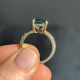 6.12ct Deep Teal Blue Madagascar Radiant Cut Sapphire Solitaire Ring with French Set Diamonds in 18k Yellow Gold