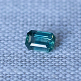 1.29CT EMERALD CUT MADAGASCAR SAPPHIRE, EMERALD GREEN WITH TEAL, 7.47X5.05X3.37MM