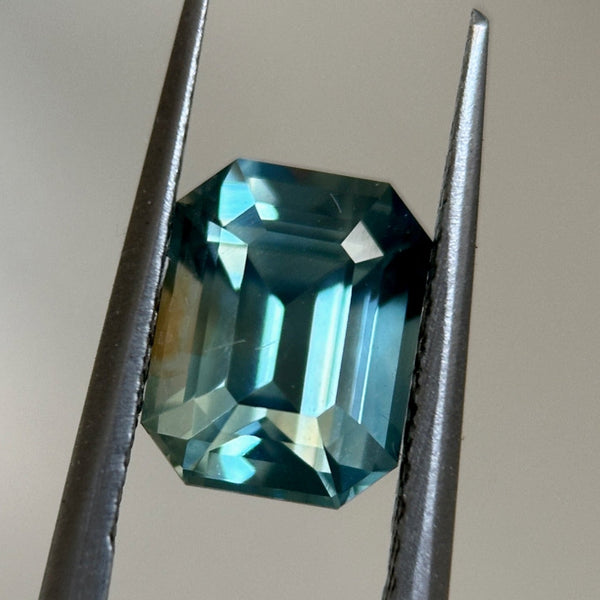 2.14CT EMERALD CUT MADAGASCAR SAPPHIRE, LIGHT GREEN TEAL WITH BROWN, 7.9X6.1X4.7MM, EARLY ACCESS