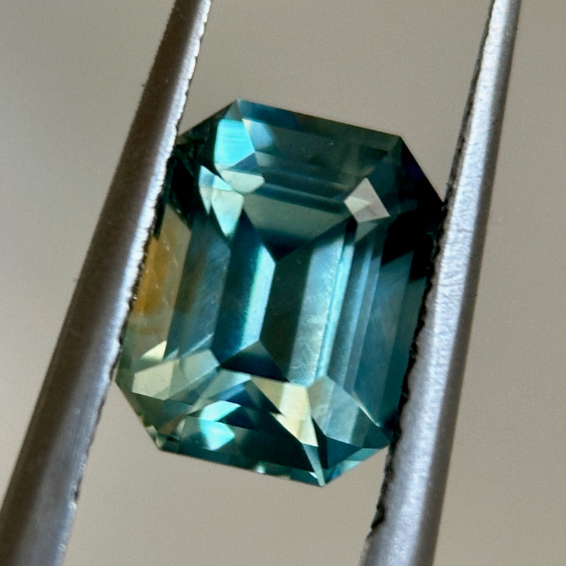 2.14CT EMERALD CUT MADAGASCAR SAPPHIRE, LIGHT GREEN TEAL WITH BROWN, 7.9X6.1X4.7MM, EARLY ACCESS