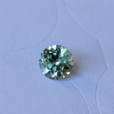 1.79CT ROUND PRECISION CUT MONTANA SAPPHIRE, LIGHT GREEN WITH PARTI BLUE, 7.3x4.71MM