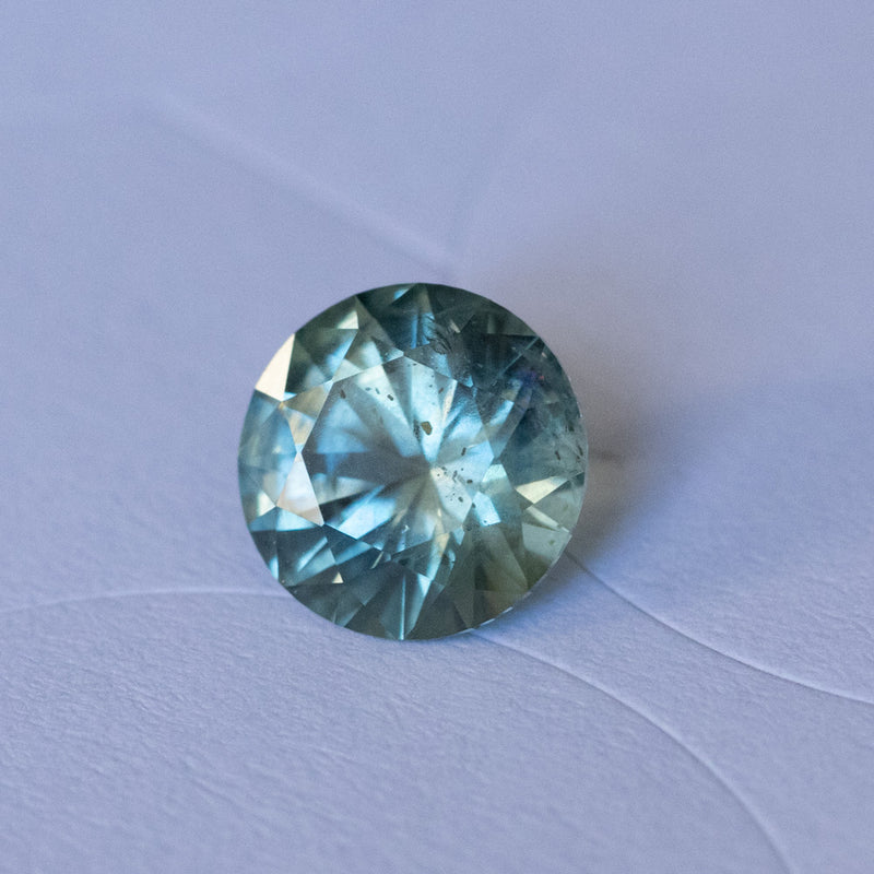 1.41CT ROUND PRECISION CUT MONTANA SAPPHIRE, PARTI MEDIUM TEAL BLUE WITH YELLOW GREEN, 6.8MM