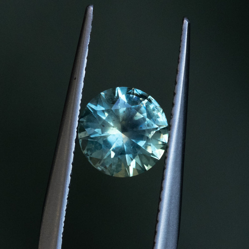 1.41CT ROUND PRECISION CUT MONTANA SAPPHIRE, PARTI MEDIUM TEAL BLUE WITH YELLOW GREEN, 6.8MM