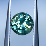 1.93CT ROUND PRECISION CUT AUSTRALIAN SAPPHIRE, GREEN WITH YELLOW AND BLUE, 7X5MM