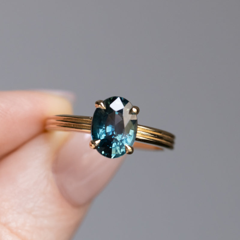 2.58ct Untreated Teal Oval Madagascar Sapphire Low Profile Tri-Band "Three Winds" 4 Prong Solitaire in 14k Yellow Gold