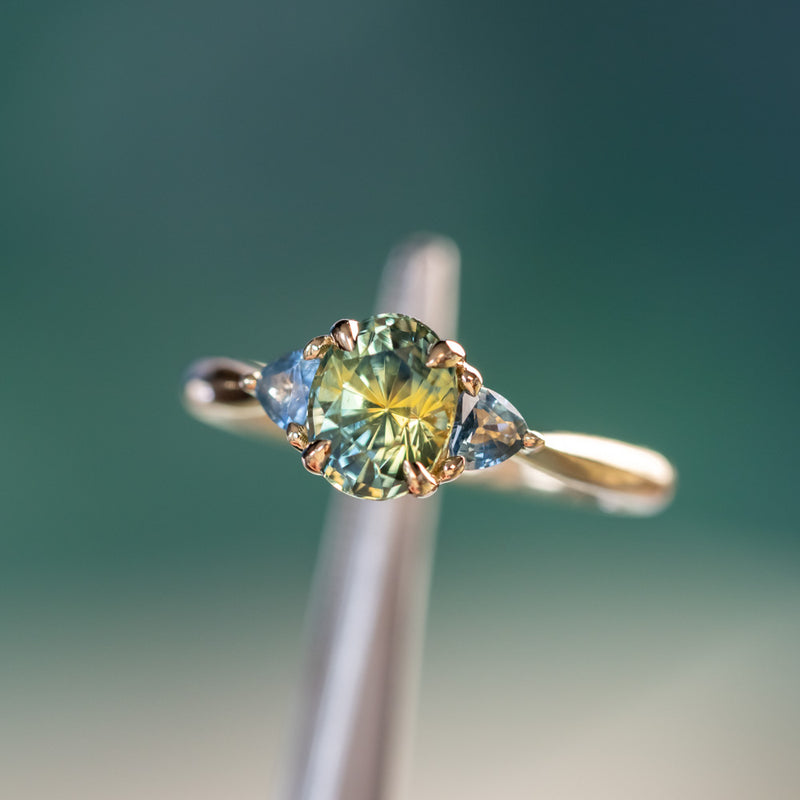 1.68ct Oval Untreated Madagascar Parti Sapphire and Trillion Sapphire Three Stone Low Profile Ring in 14k Yellow Gold