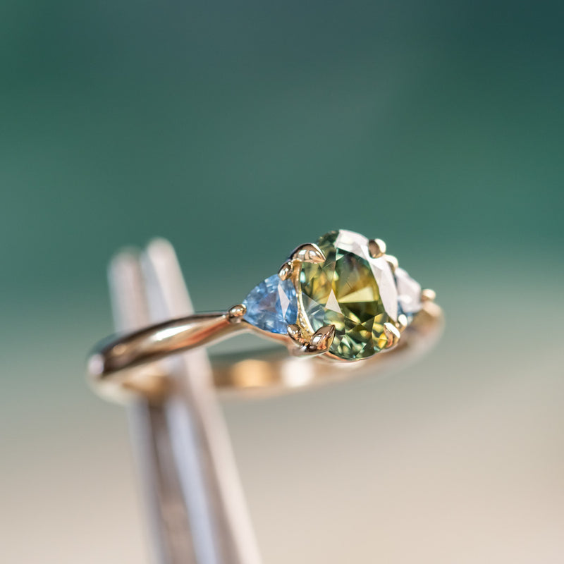 1.68ct Oval Untreated Madagascar Parti Sapphire and Trillion Sapphire Three Stone Low Profile Ring in 14k Yellow Gold