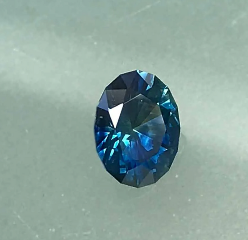 1.60CT OVAL BRILLIANT PRECISION CUT MONTANA SAPPHIRE, PARTI DEEP TEAL BLUE, 8.2X6.2X4.3MM