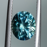 1.98ct Oval Precision Cut Teal Montana Sapphire and Princess Cut Diamond Rapids Low Profile Ring in 14k Yellow Gold