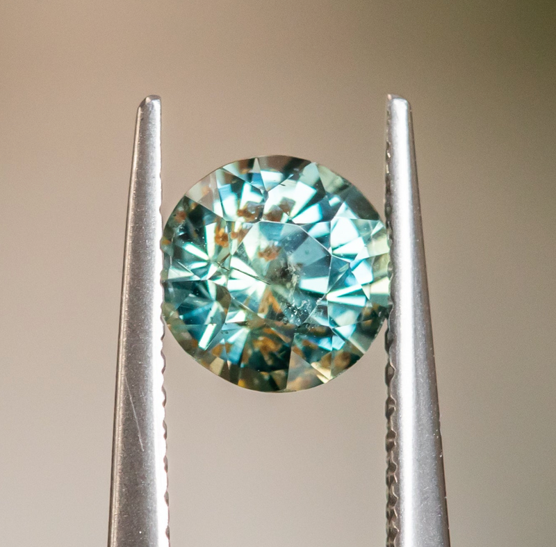 2.25ct Precision Cut Round Teal Green Montana Sapphire Scallop Cup Solitaire in 18k Yellow gold with hidden Diamonds