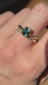 1.68ct Radiant Cut Teal Sapphire Cathedral Double Prong Solitaire in 18k Yellow Gold