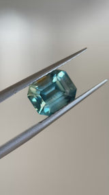 2.14CT EMERALD CUT MADAGASCAR SAPPHIRE, LIGHT GREEN TEAL WITH BROWN, 7.9X6.1X4.7MM, EARLY ACCESS