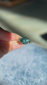 1.82ct Round Teal Precision Cut Montana Sapphire and Trillion Sapphire Low Profile Three Stone Ring in 18k Yellow Gold
