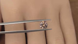 1.34CT PRECISION CUT ROUND BRILLIANT MONTANA SAPPHIRE, BICOLOR ORANGE-PINK, 6.5MM