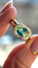 1.93ct Untreated Oval Brilliant Nigerian Parti Sapphire East-West Bezel Solitaire Alluvial Style Ring in 14k Green Gold