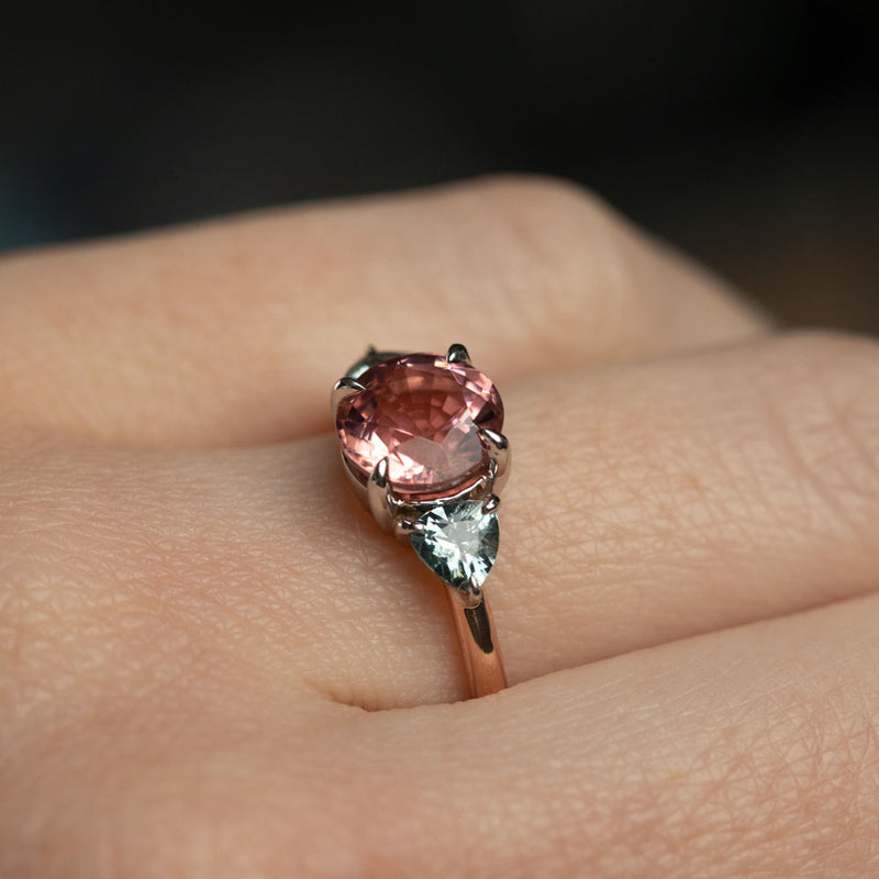 1.70ct Round Pink Tourmaline and Blue Grey Spinel Low Profile Three Stone Ring in 14k Rose and White Gold on hand